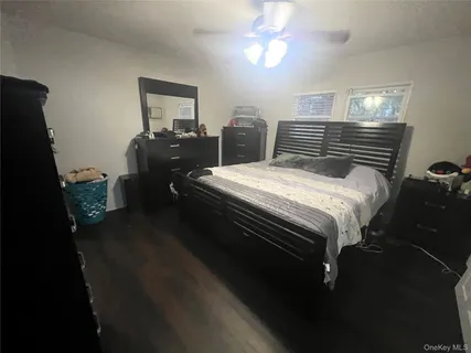 a bedroom with bed and window