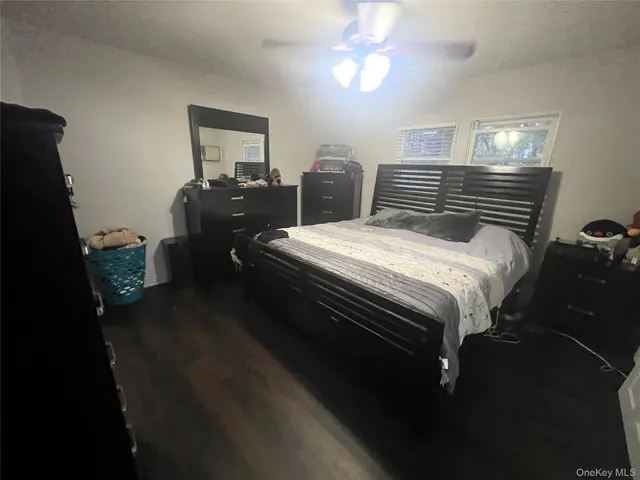 a bedroom with bed and window