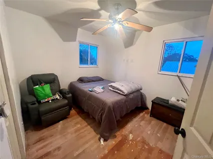 a bedroom with a bed and a couch