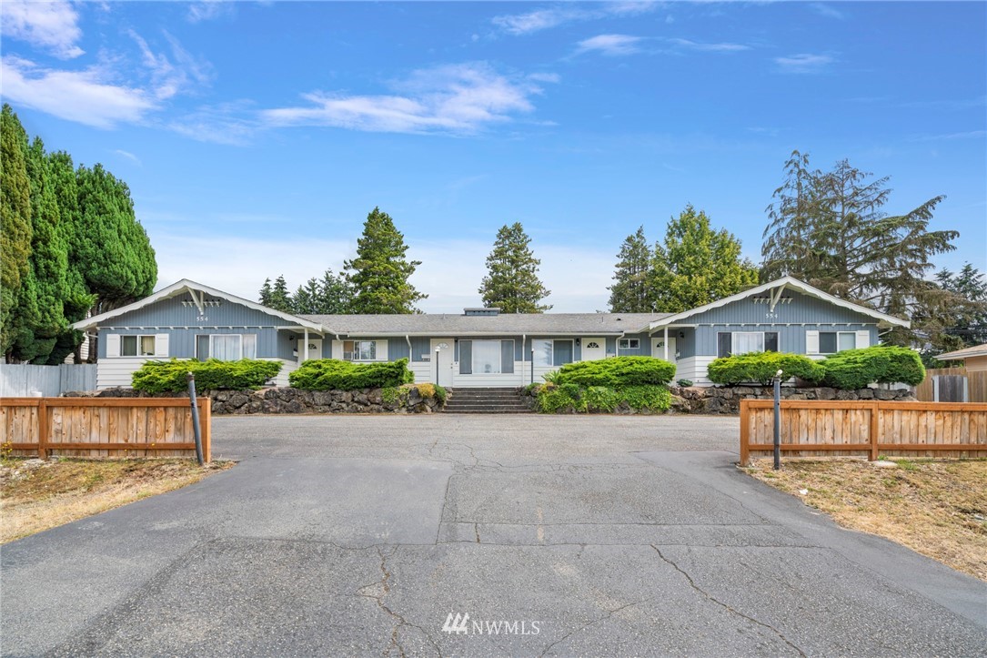 554 Index Place Northeast Renton, WA 98056 - Photo 1 of 17 front view of a house with a yard