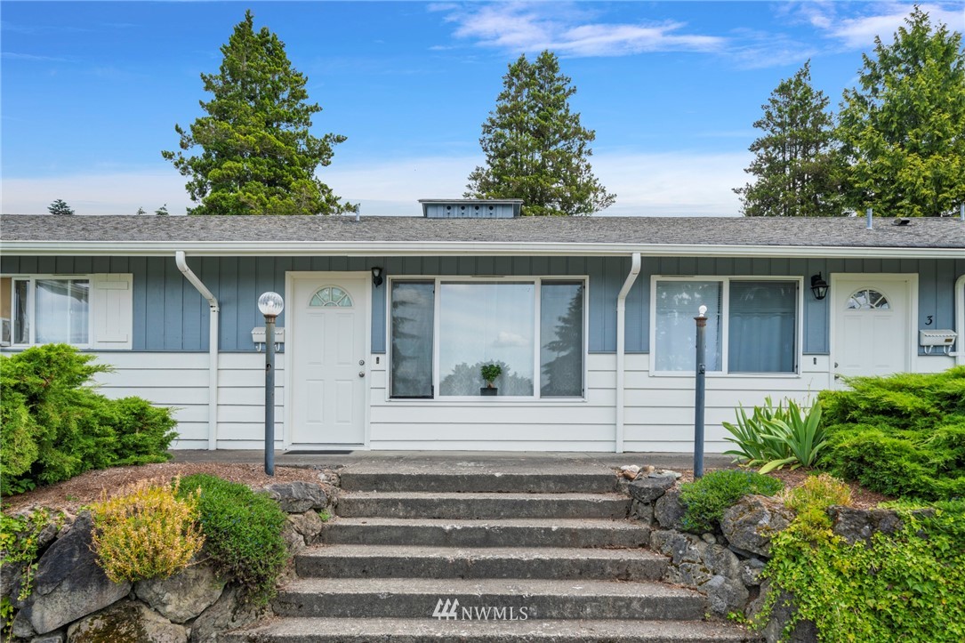 554 Index Place Northeast Renton, WA 98056 - Photo 3 of 17 a view of a house with a window and potted plants