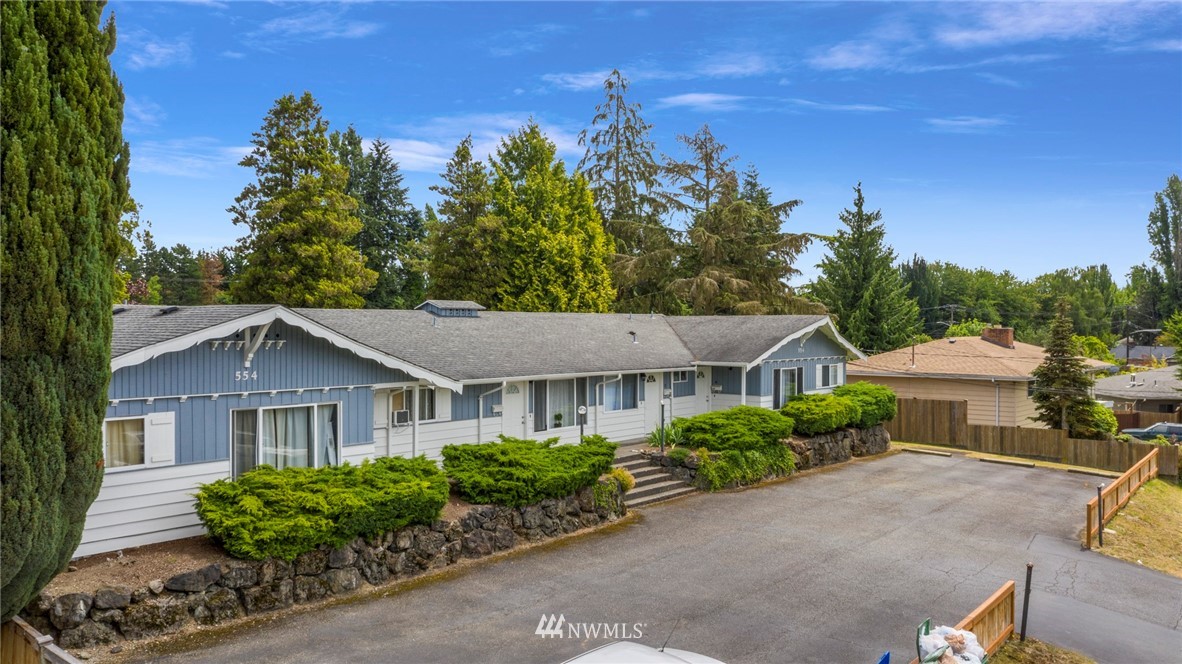 554 Index Place Northeast Renton, WA 98056 - Photo 7 of 17 a view of a house with a yard and potted plants