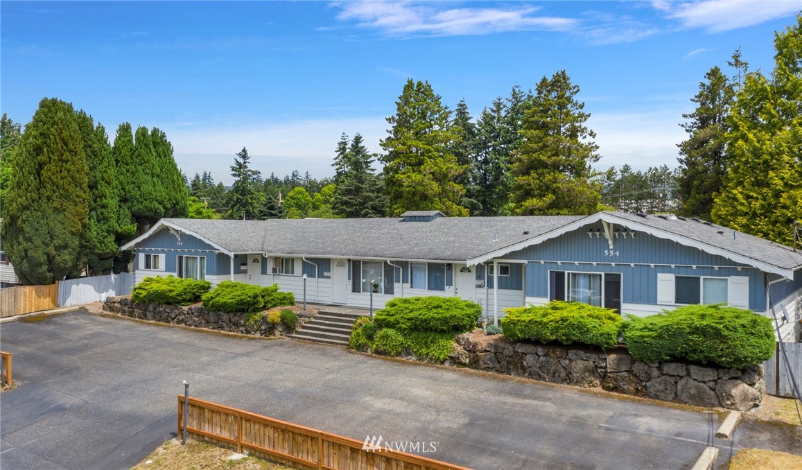 554 Index Place Northeast Renton, WA 98056 - Photo 8 of 17 a front view of a house with a yard