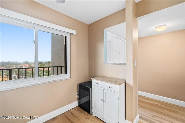 a room with a window and wooden floor