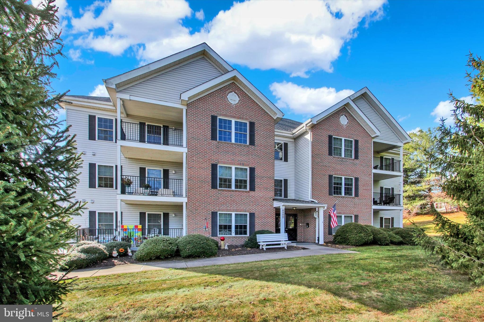 6500 Ridenour Way East, Unit 3C Sykesville, MD 21784 - Photo 1 of 22 a front view of house with yard and green space