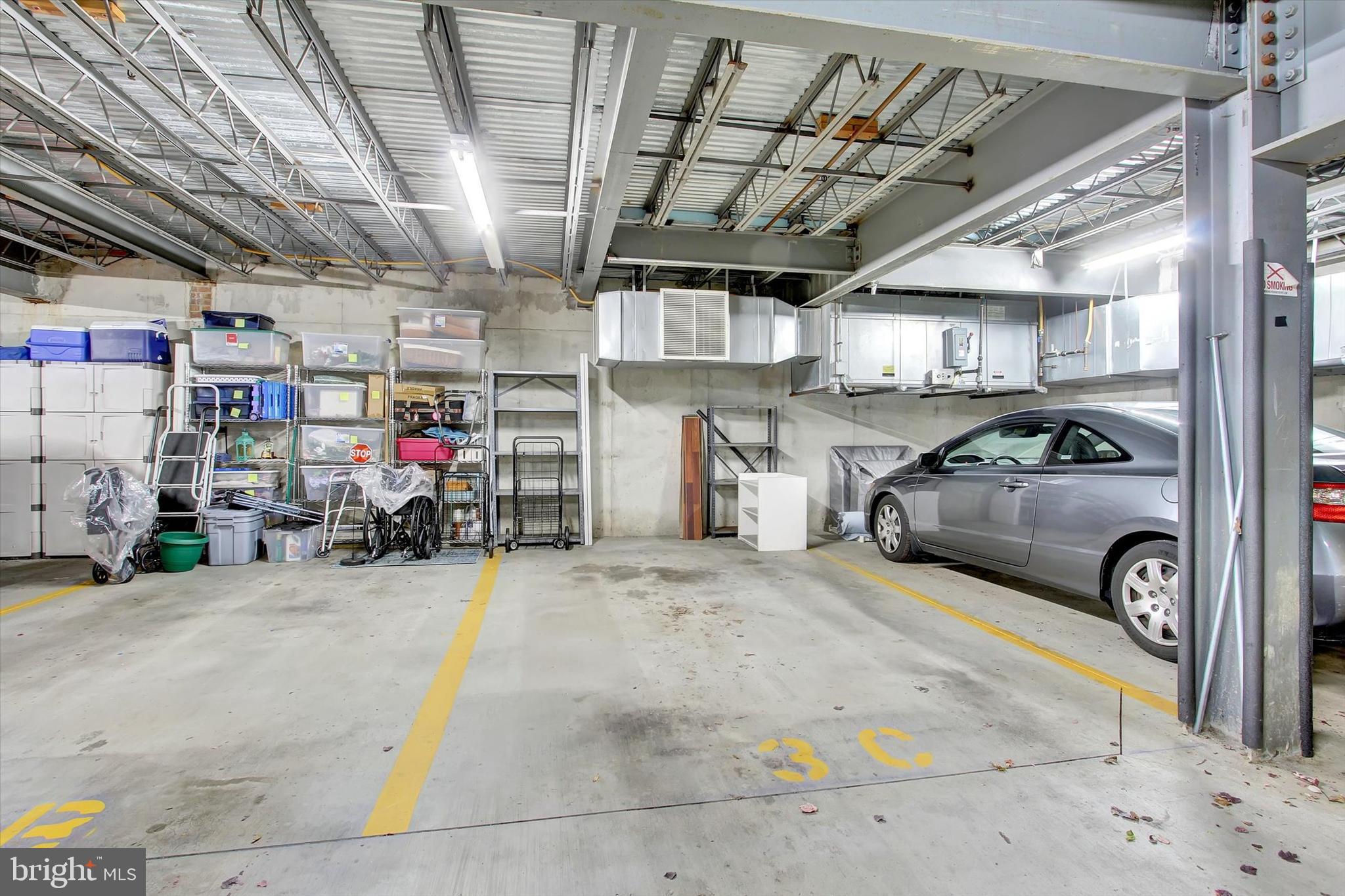6500 Ridenour Way East, Unit 3C Sykesville, MD 21784 - Photo 18 of 22 a view of parking garage with cars