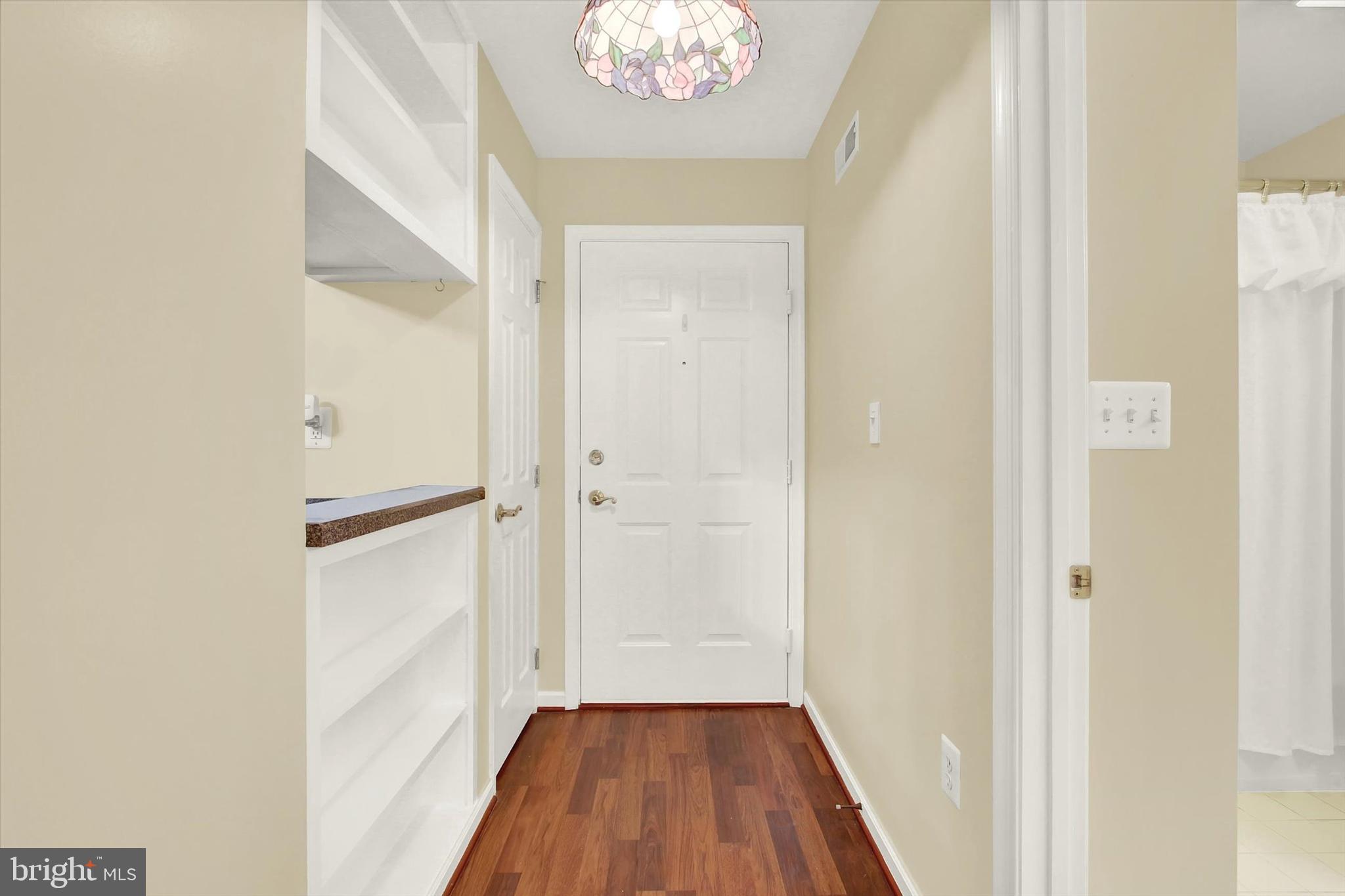 6500 Ridenour Way East, Unit 3C Sykesville, MD 21784 - Photo 2 of 22 a view of a hallway with wooden floor