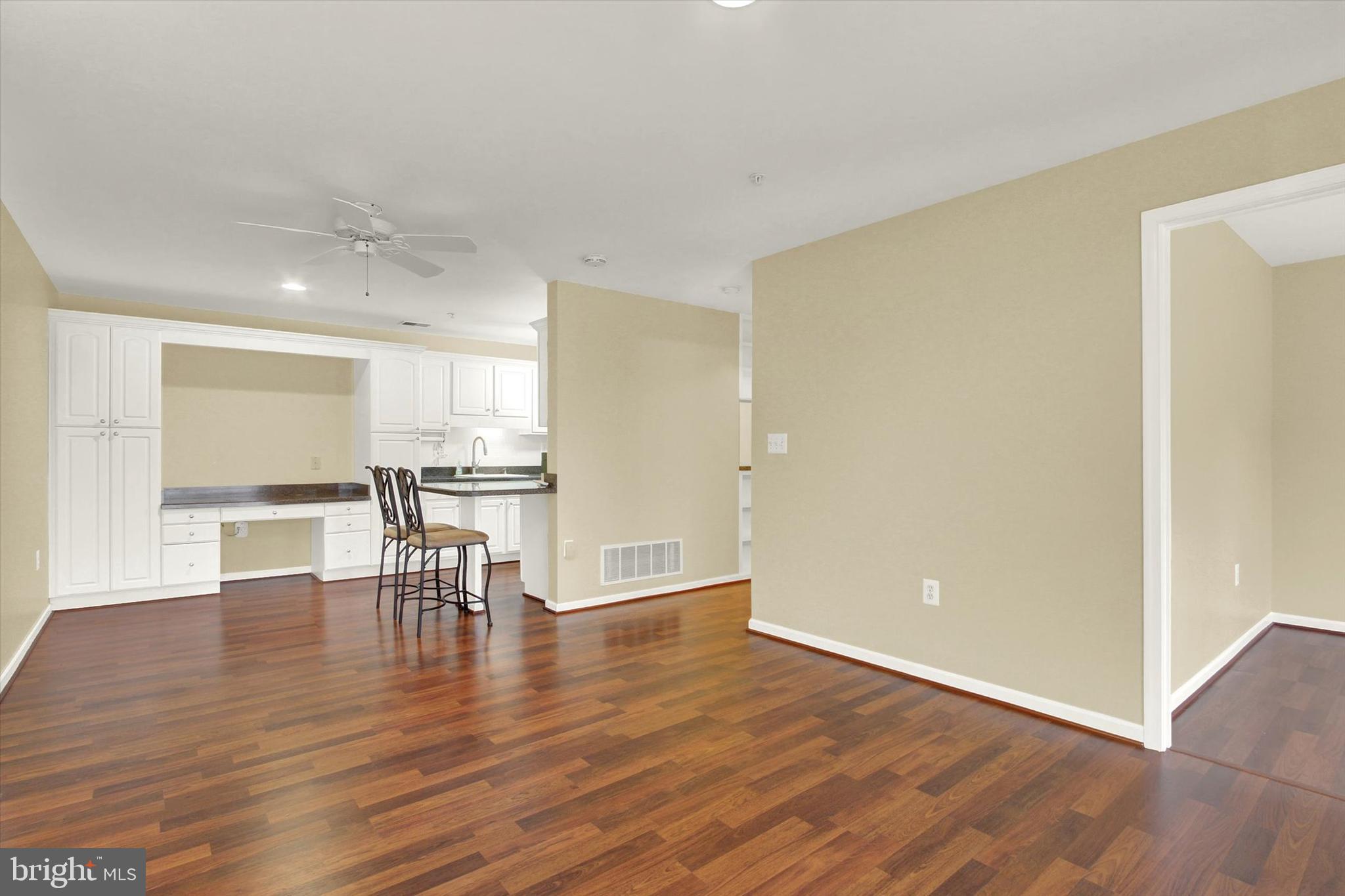 6500 Ridenour Way East, Unit 3C Sykesville, MD 21784 - Photo 4 of 22 a view of kitchen with furniture and wooden floor