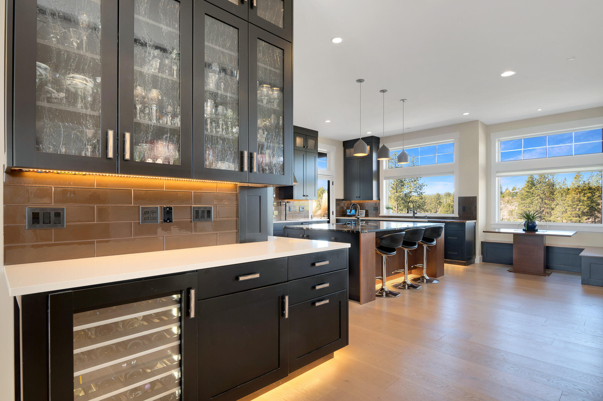 60871 River Rim Drive Bend, OR 97702 - Photo 11 of 42 a open kitchen with stainless steel appliances granite countertop a lot of counter space and a large window