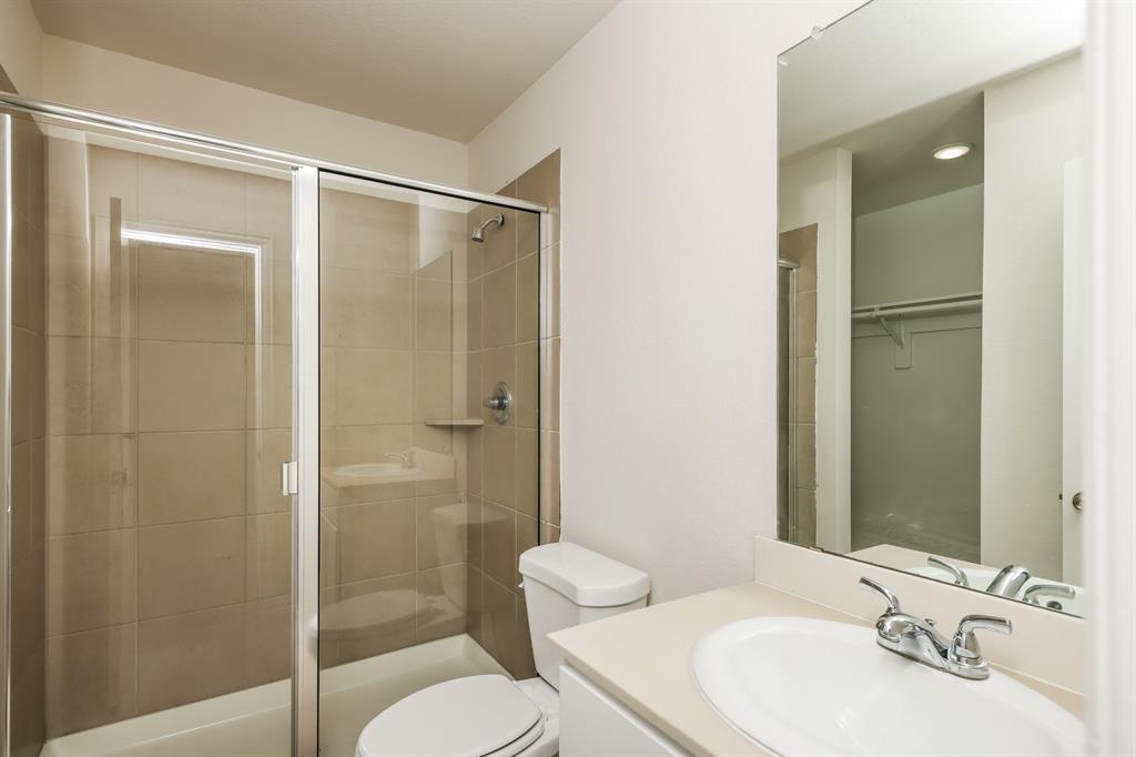 2712 William Street Mabank, TX 75147 - Photo 15 of 20 a bathroom with a sink toilet and shower