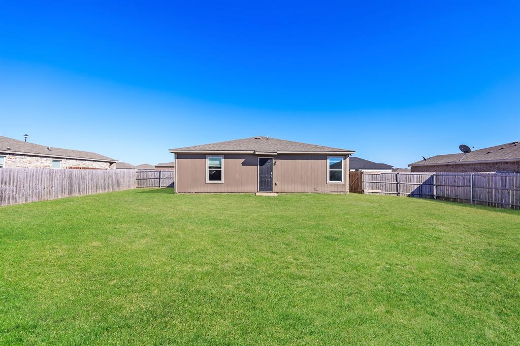 2712 William Street Mabank, TX 75147 - Photo 17 of 20 a view of a house with backyard