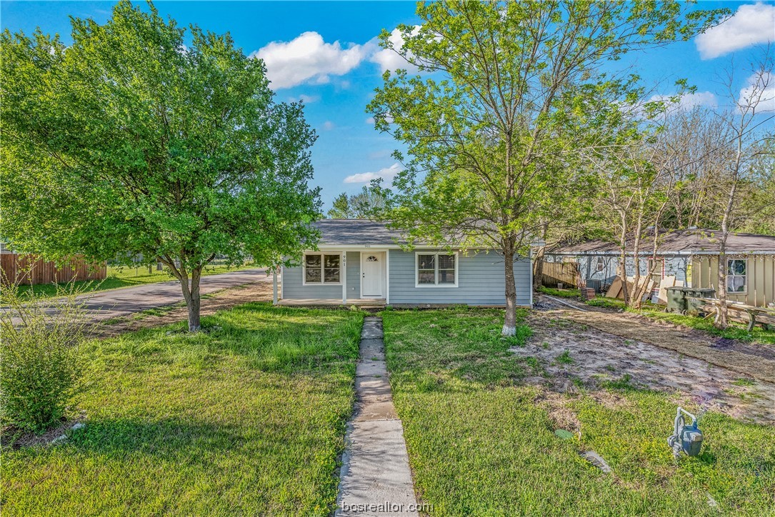 901 Boulevard Street Bryan, TX 77803 - Photo 1 of 1 a front view of a house with garden