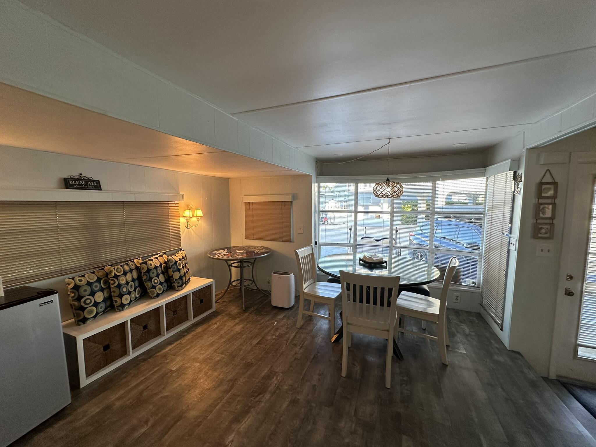 65821 Overseas Highway, Unit 310 Long Key, FL 33001 - Photo 15 of 32 a table and chairs in a room next to a window