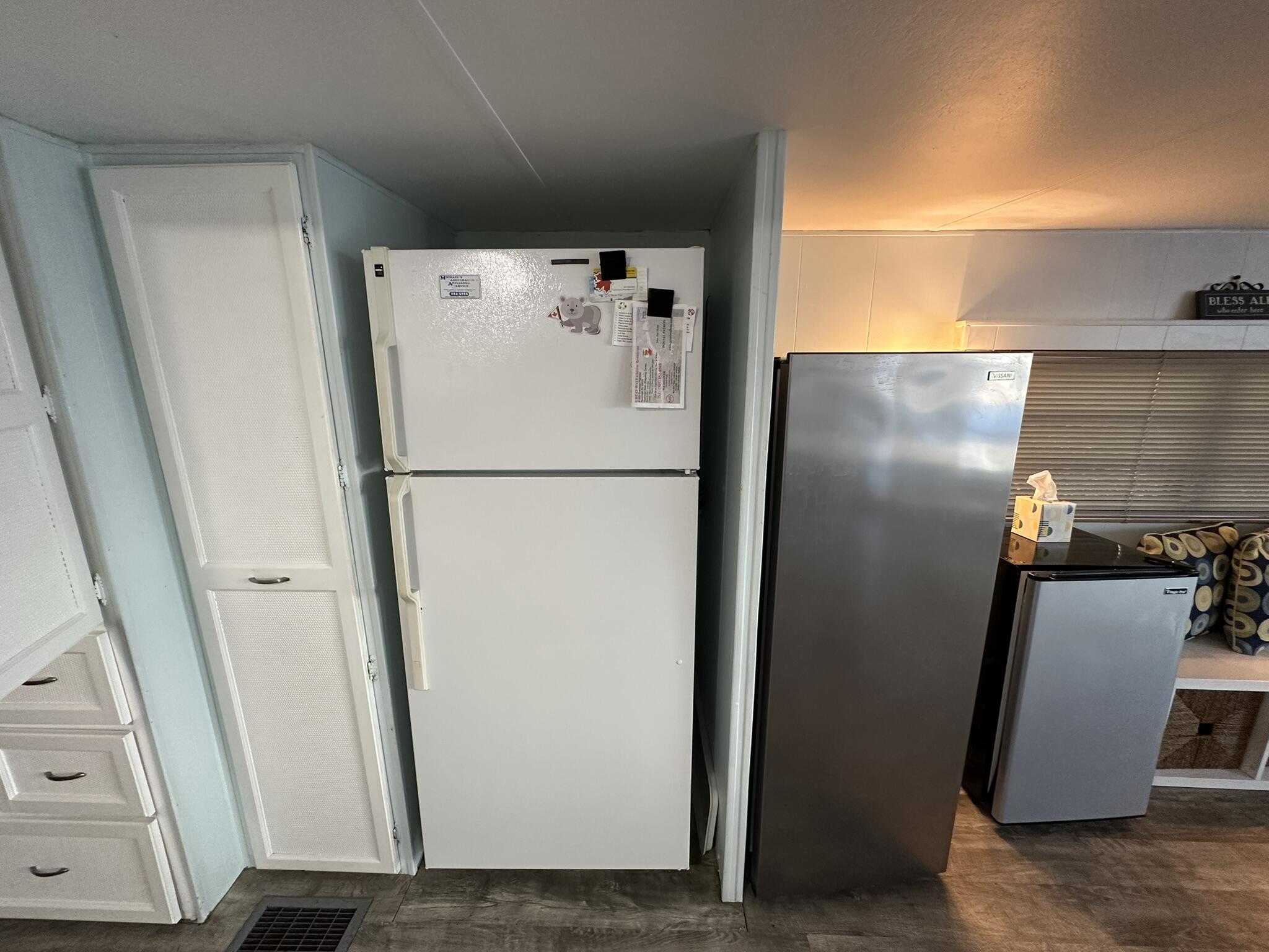 65821 Overseas Highway, Unit 310 Long Key, FL 33001 - Photo 16 of 32 a white refrigerator freezer and a microwave in a shelf
