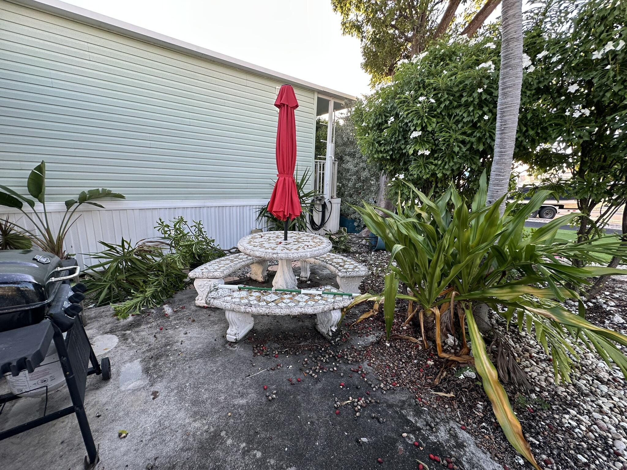 65821 Overseas Highway, Unit 310 Long Key, FL 33001 - Photo 28 of 32 a backyard of a house with outdoor seating