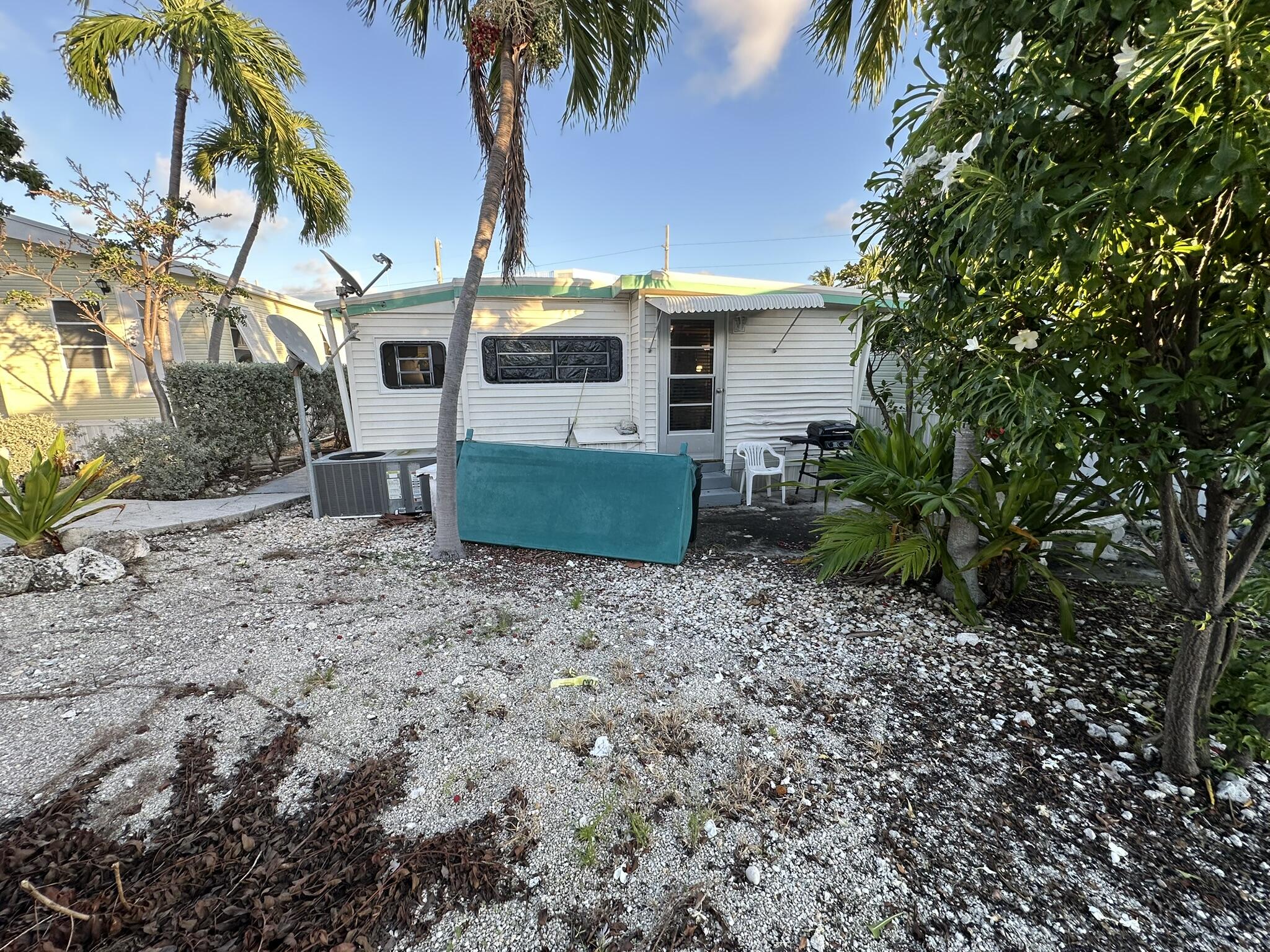 65821 Overseas Highway, Unit 310 Long Key, FL 33001 - Photo 29 of 32 a view of a house with backyard and a garden