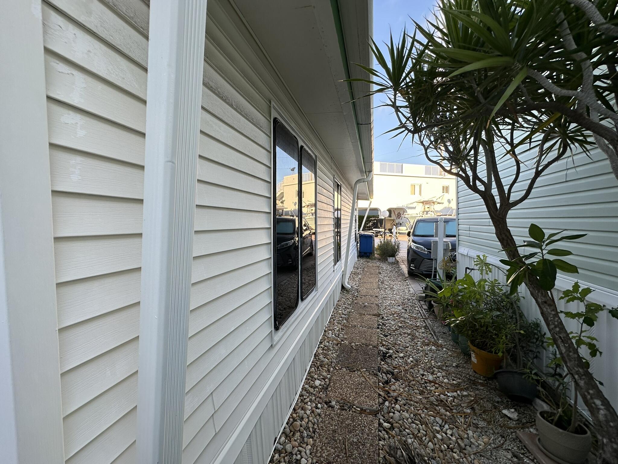 65821 Overseas Highway, Unit 310 Long Key, FL 33001 - Photo 30 of 32 a view of a pathway of a house with a yard