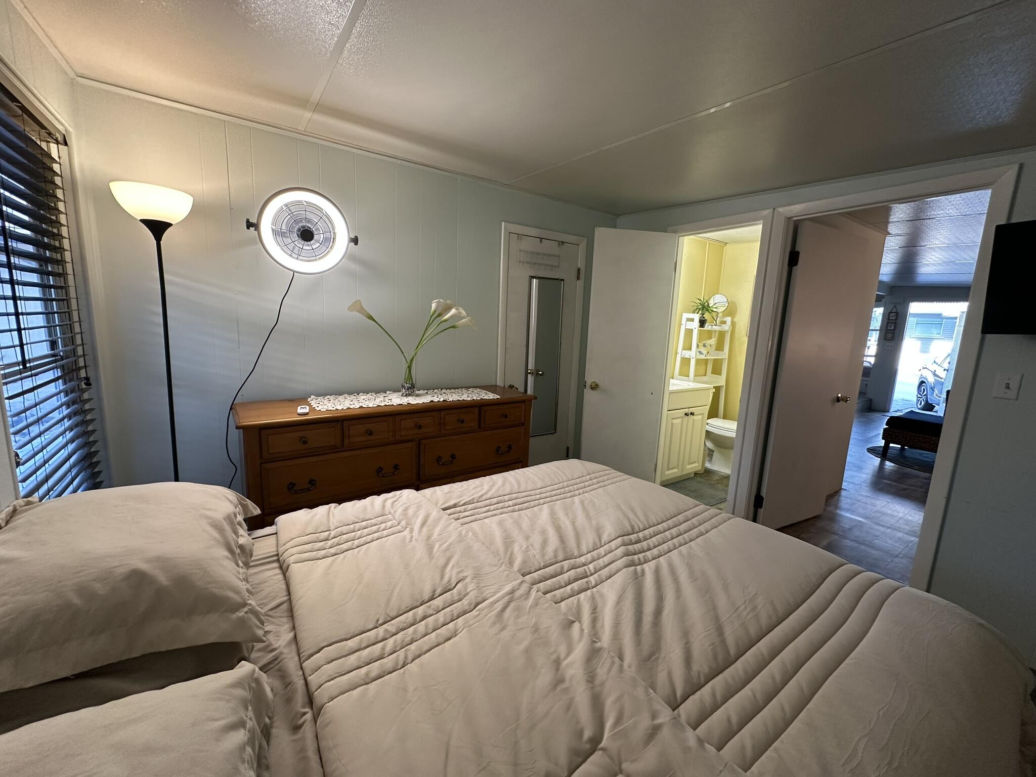 65821 Overseas Highway, Unit 310 Long Key, FL 33001 - Photo 5 of 32 a bedroom with a bed and a mirror