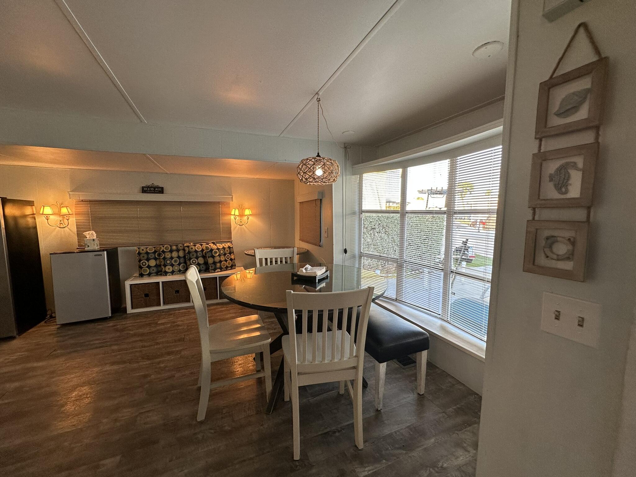 65821 Overseas Highway, Unit 310 Long Key, FL 33001 - Photo 9 of 32 a dining room with furniture and window