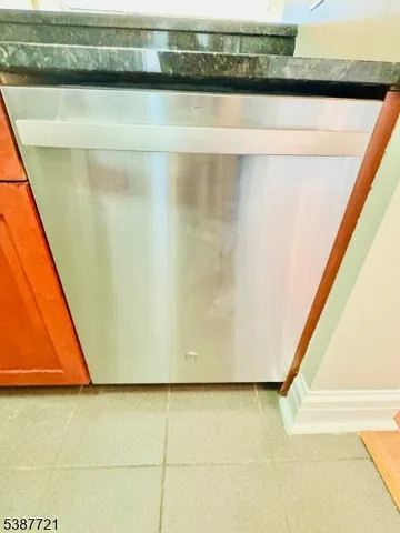 a view of a balcony with wooden floor and outdoor seating