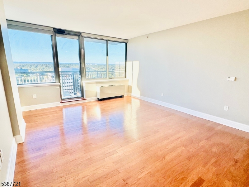1806 One Spring Street, Unit 1806 New Brunswick, NJ 08901 - Photo 15 of 49 a view of an empty room with a window