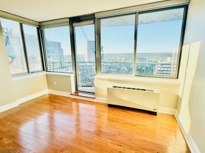 1806 One Spring Street, Unit 1806 New Brunswick, NJ 08901 - Photo 16 of 49 a view of an empty room with a window