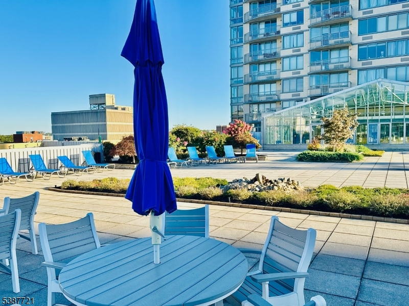 1806 One Spring Street, Unit 1806 New Brunswick, NJ 08901 - Photo 39 of 49 a view of a swimming pool with outdoor seating