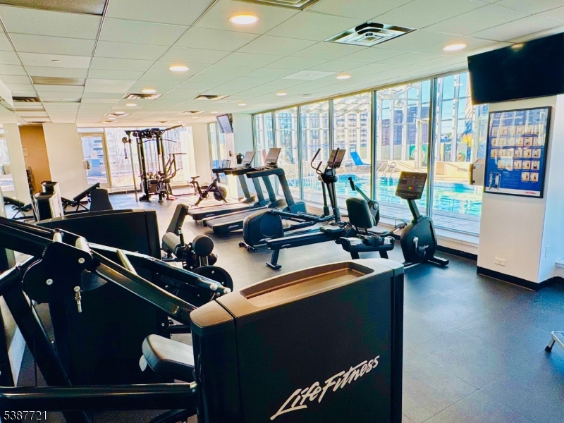 1806 One Spring Street, Unit 1806 New Brunswick, NJ 08901 - Photo 44 of 49 a view of a room with gym equipment