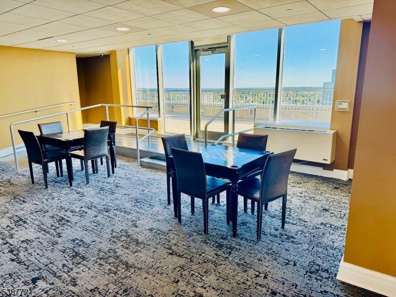 1806 One Spring Street, Unit 1806 New Brunswick, NJ 08901 - Photo 48 of 49 a view of a dining room with furniture window and outside view