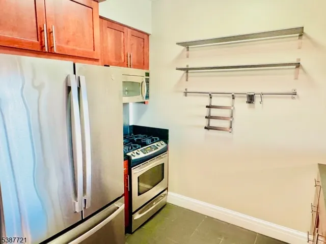 a stove top oven sitting inside of a kitchen