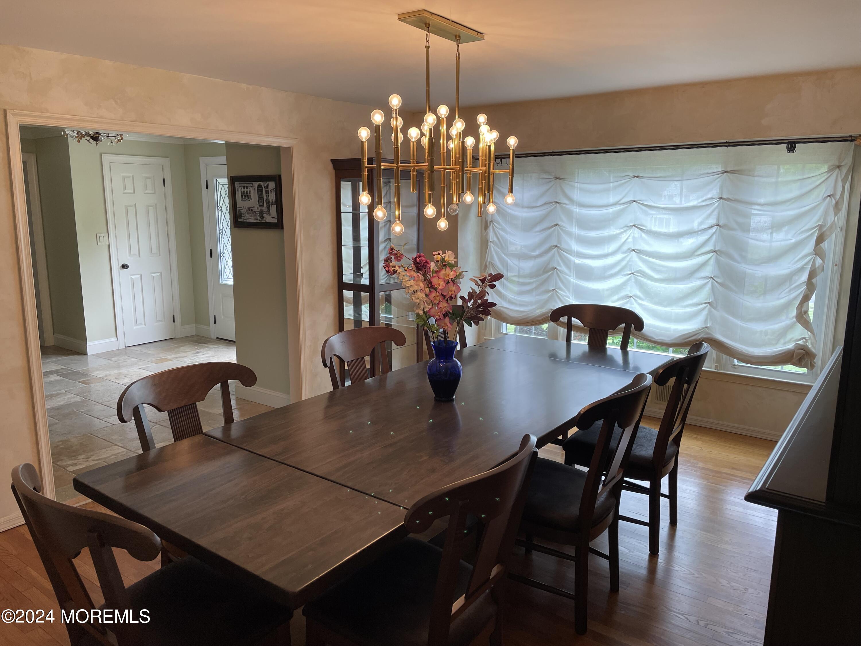 1 Longstreet Road Manalapan, NJ 07726 - Photo 20 of 76 a view of a dining room with furniture and wooden floor