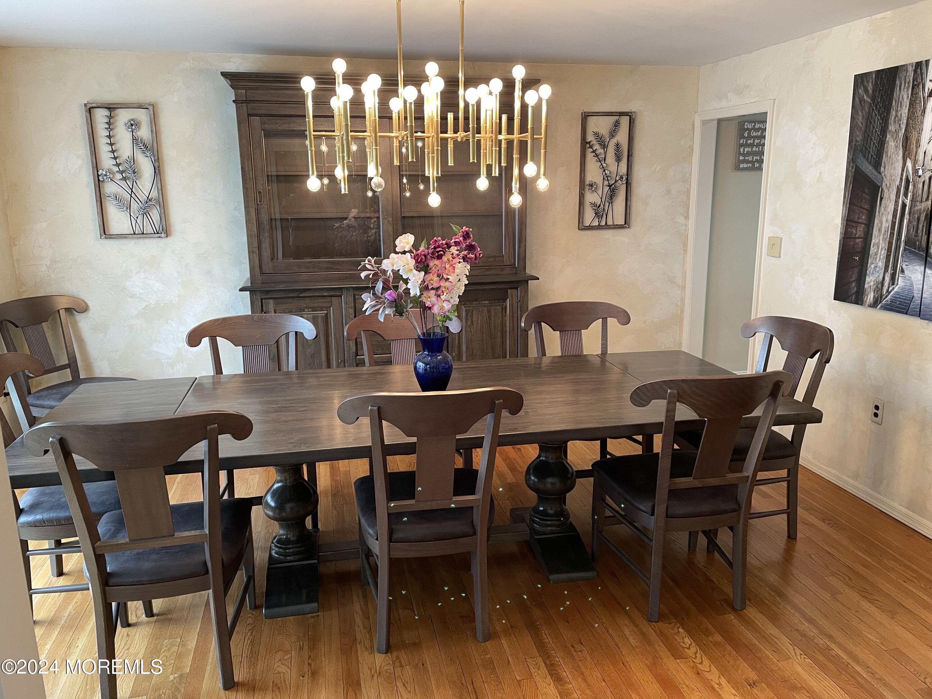 1 Longstreet Road Manalapan, NJ 07726 - Photo 21 of 76 a view of a dining room with furniture and chandelier
