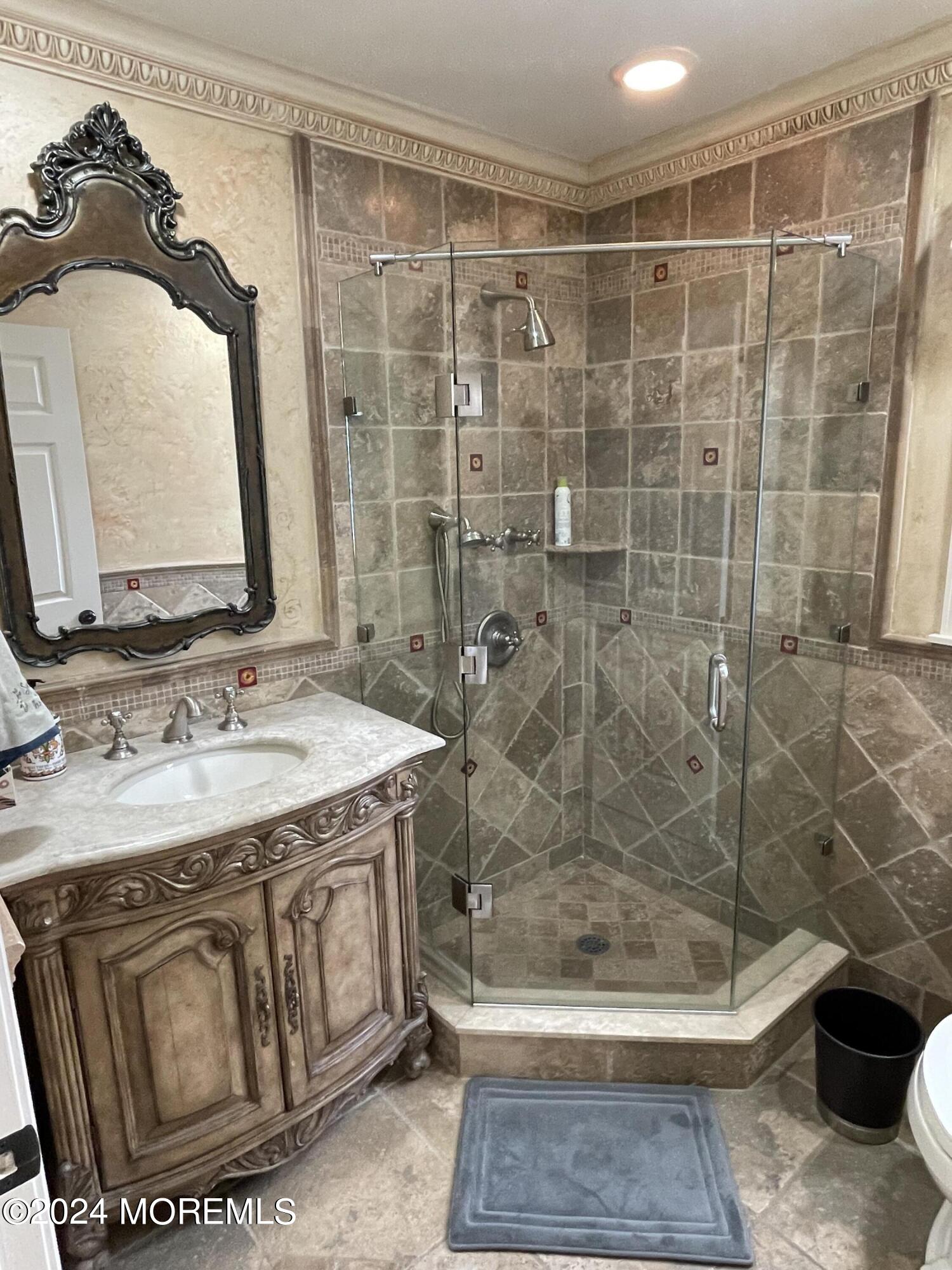 1 Longstreet Road Manalapan, NJ 07726 - Photo 22 of 76 a bathroom with a sink a toilet and shower