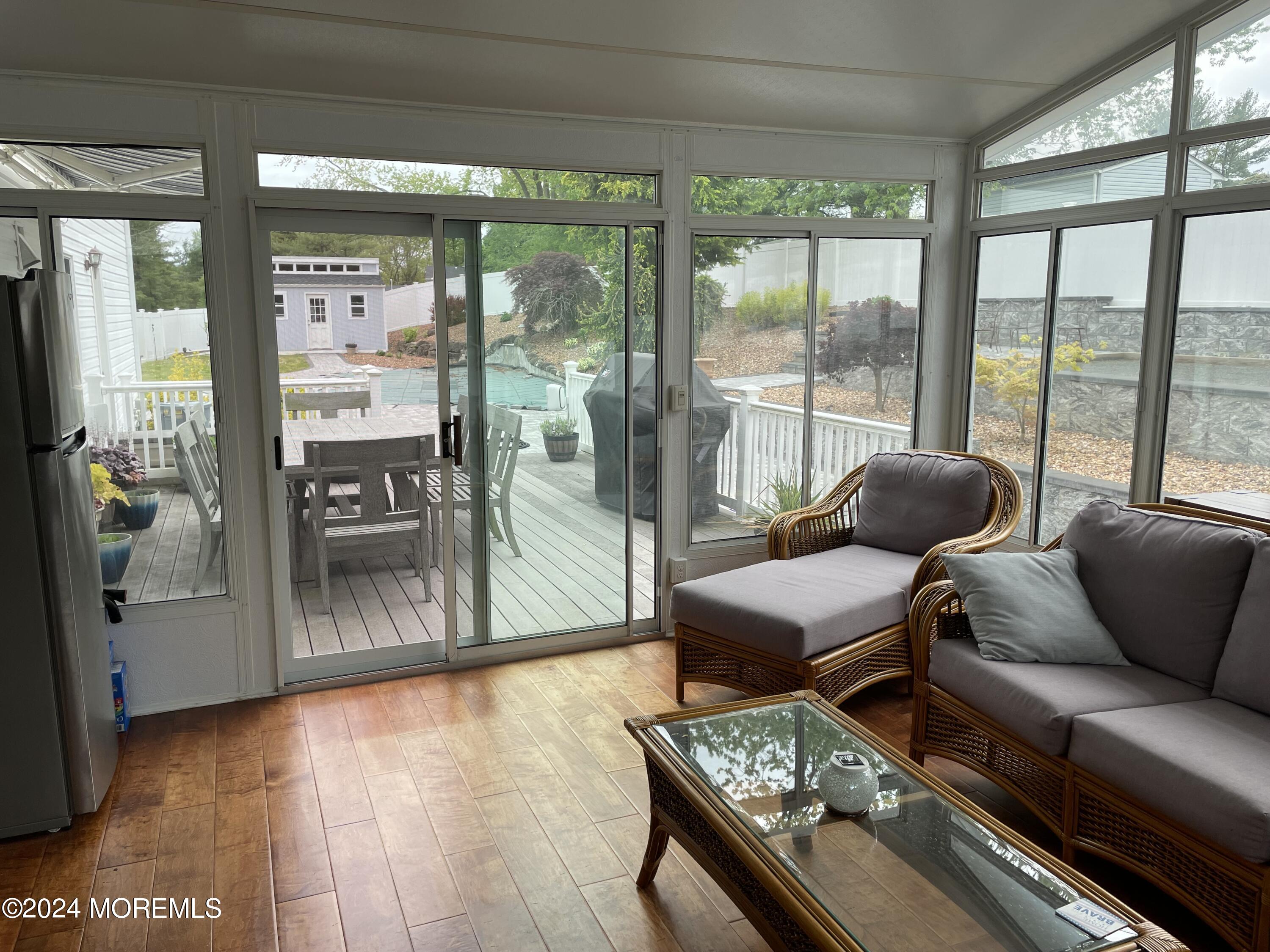 1 Longstreet Road Manalapan, NJ 07726 - Photo 25 of 76 a living room with furniture and a floor to ceiling window