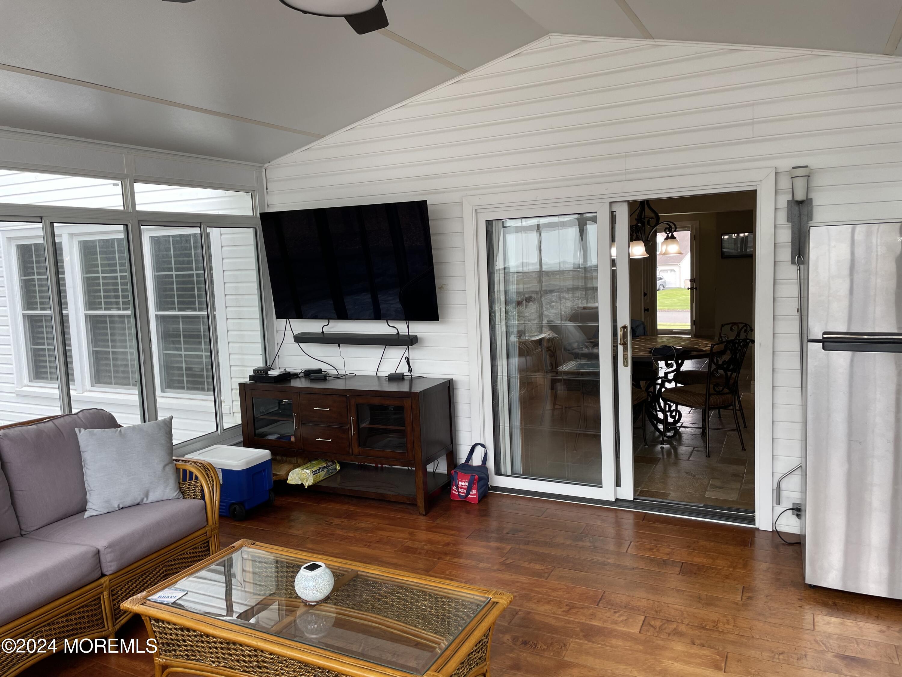 1 Longstreet Road Manalapan, NJ 07726 - Photo 26 of 76 a living room with furniture and a flat screen tv