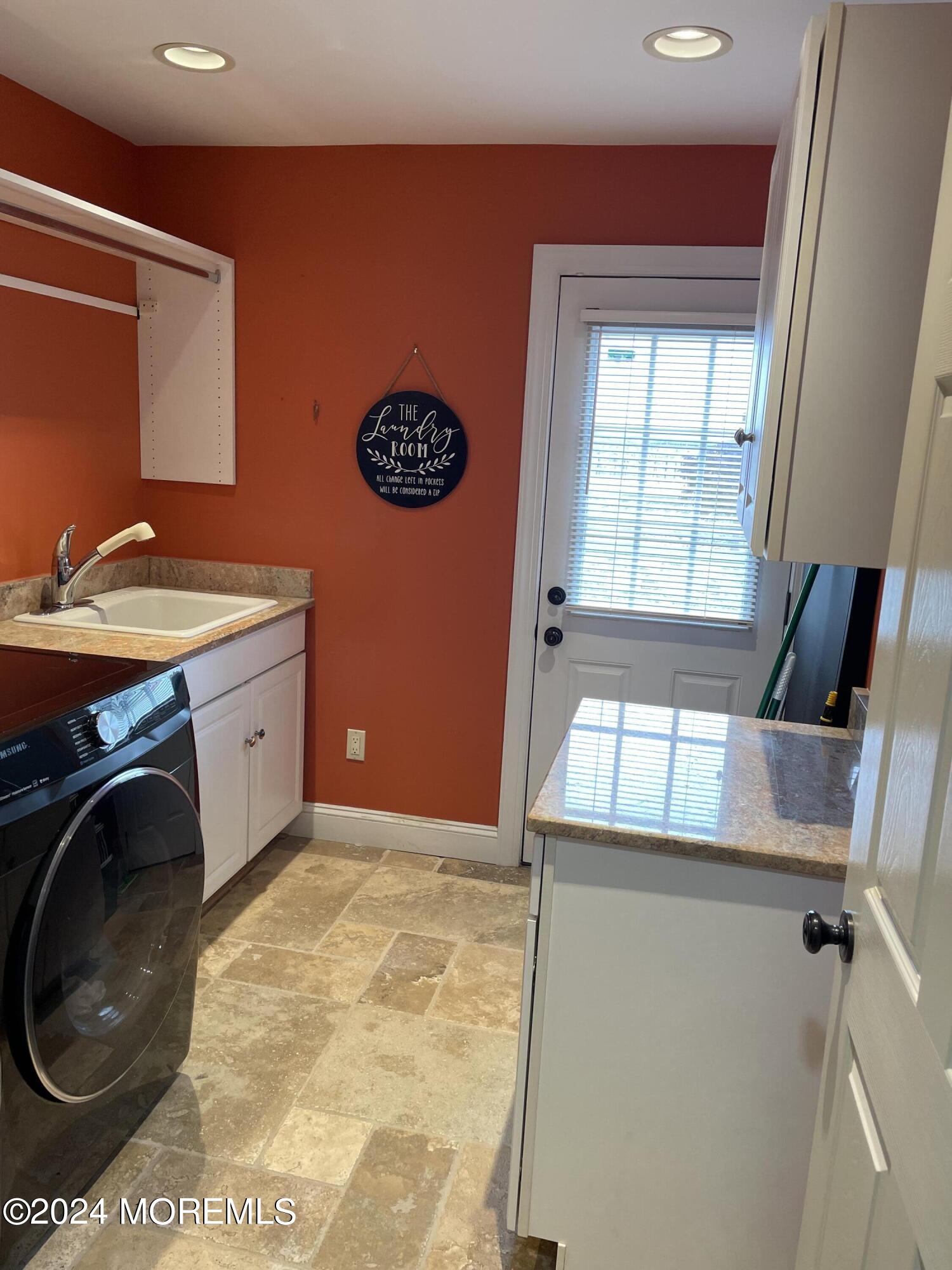 1 Longstreet Road Manalapan, NJ 07726 - Photo 28 of 76 a view of a kitchen with a sink and a washer dryer