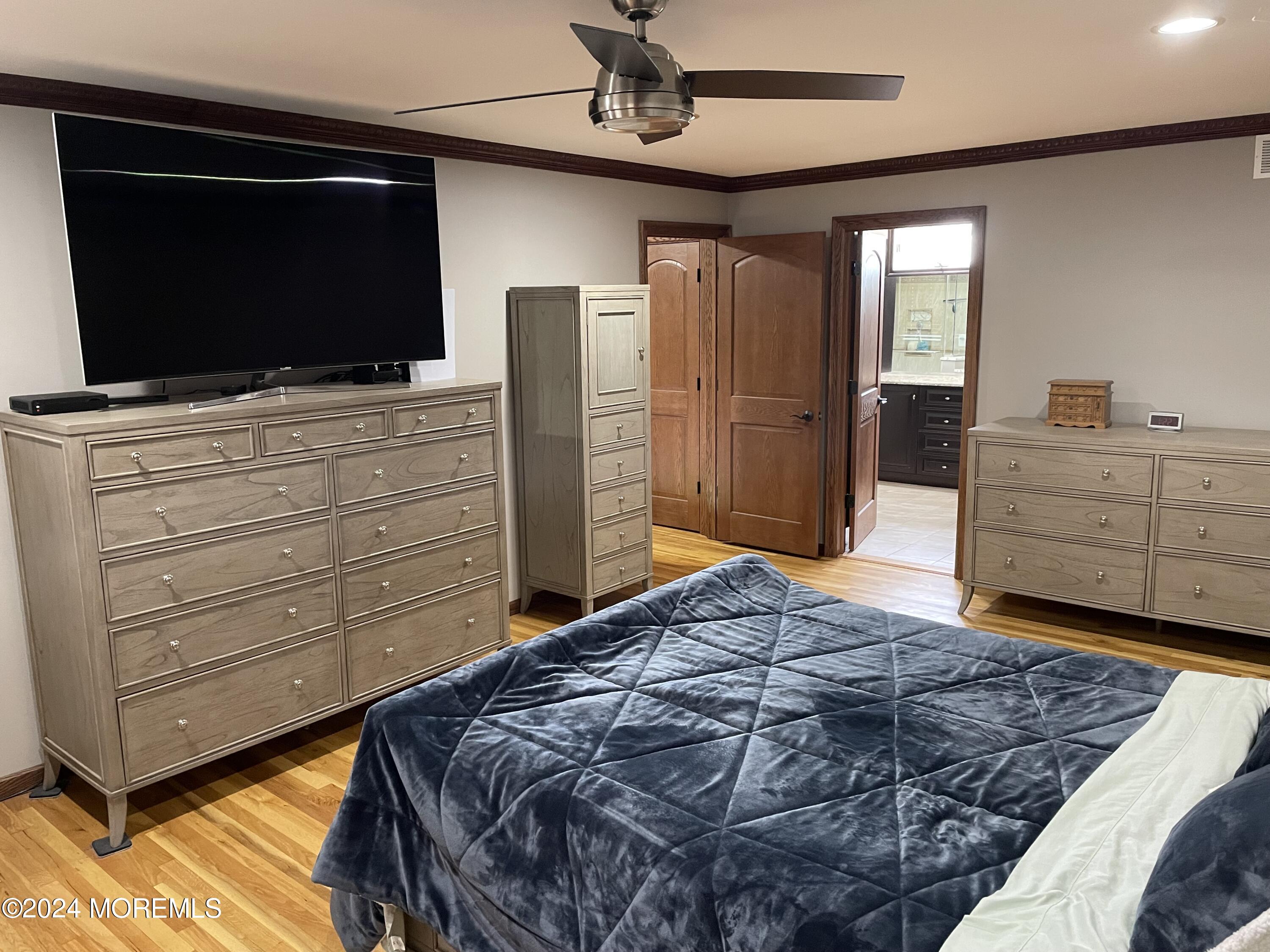 1 Longstreet Road Manalapan, NJ 07726 - Photo 31 of 76 a bedroom with a bed and flat screen tv