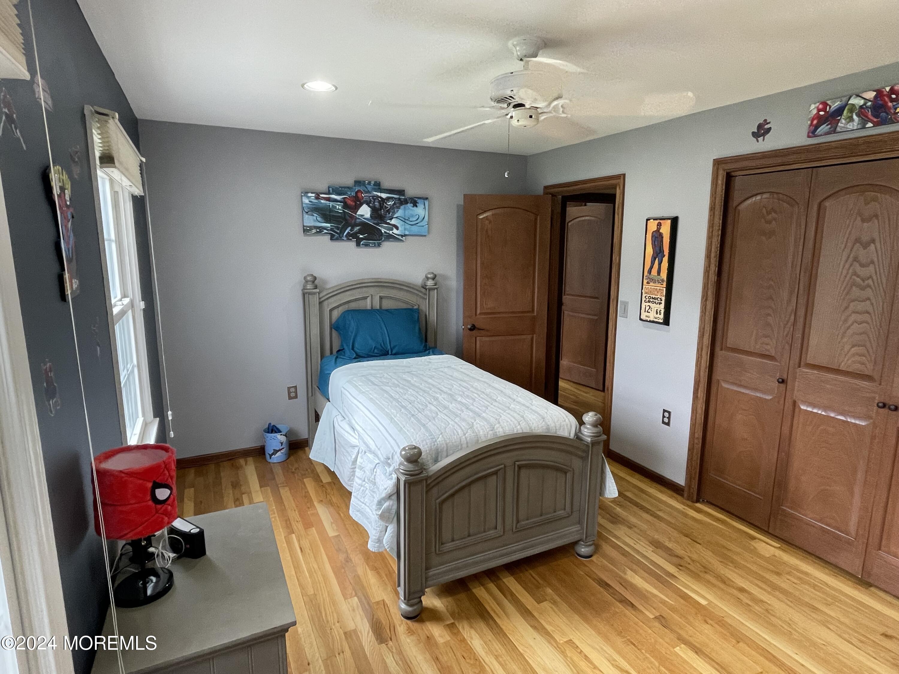 1 Longstreet Road Manalapan, NJ 07726 - Photo 36 of 76 a bedroom with a bed and a chandelier