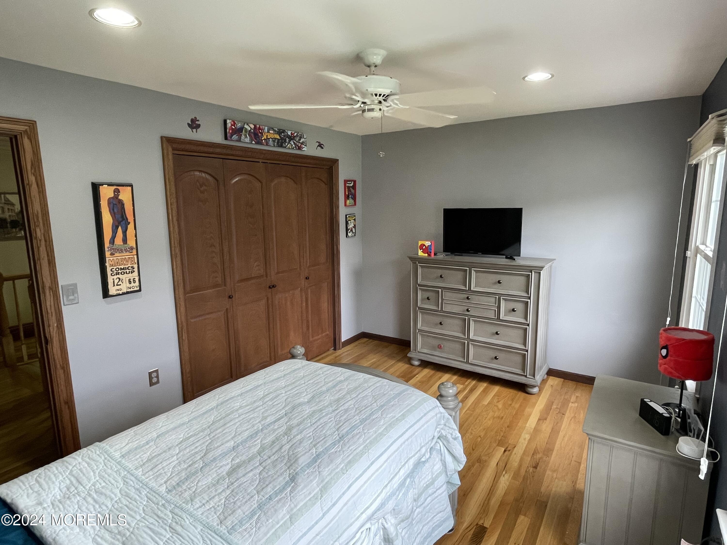 1 Longstreet Road Manalapan, NJ 07726 - Photo 37 of 76 a bedroom with a bed and a television in it