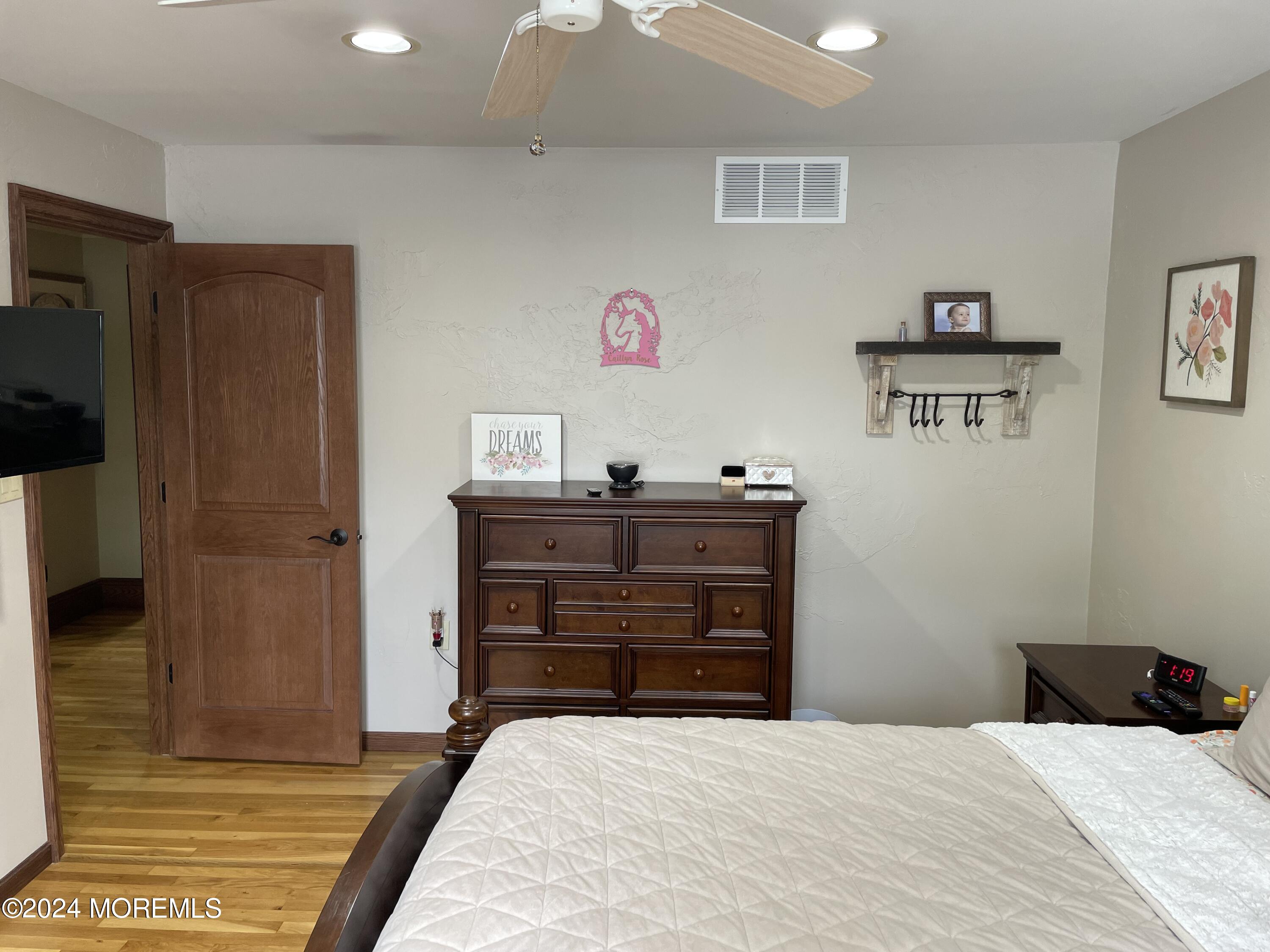 1 Longstreet Road Manalapan, NJ 07726 - Photo 39 of 76 a bedroom with a bed and a dresser