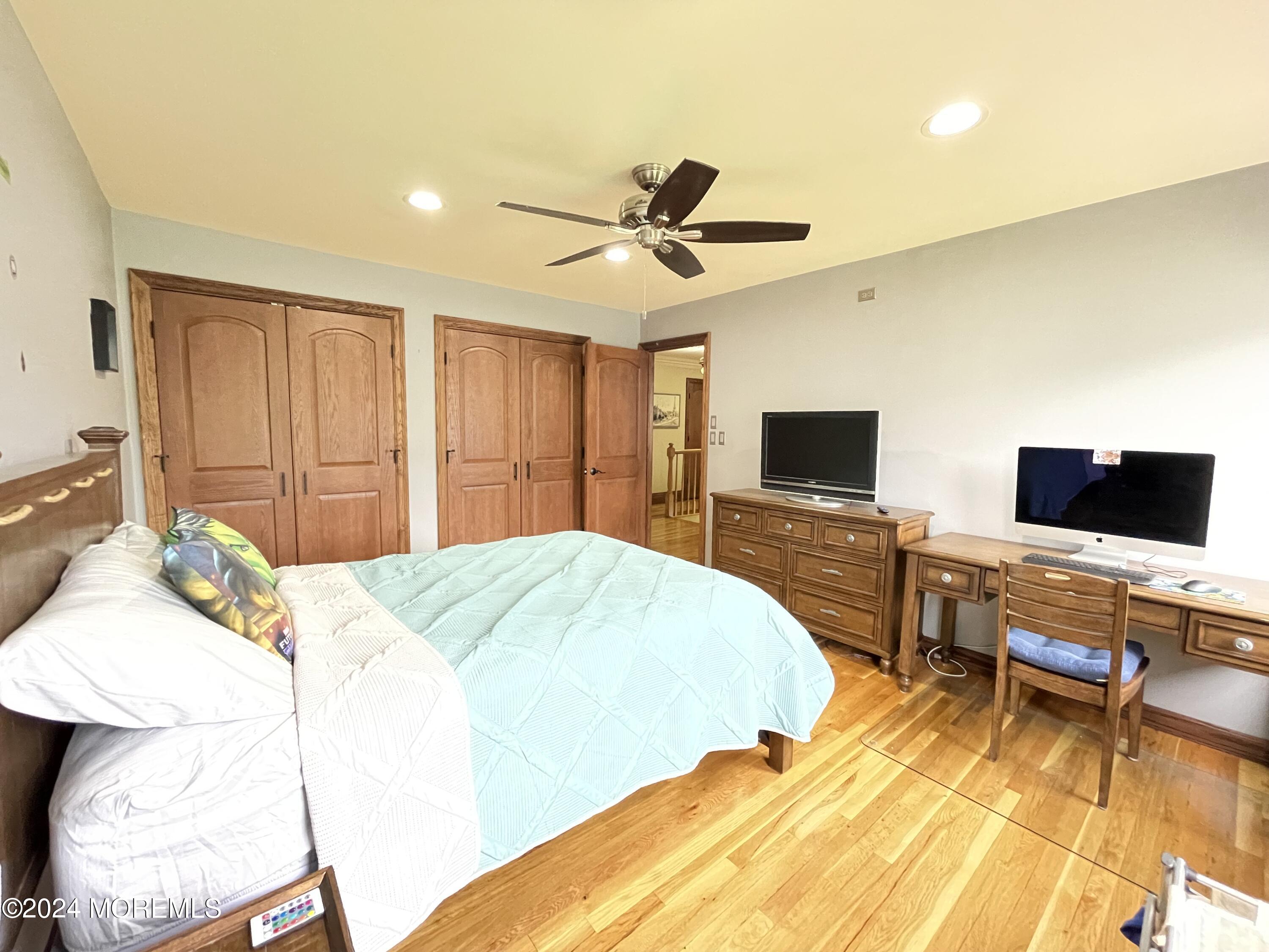 1 Longstreet Road Manalapan, NJ 07726 - Photo 43 of 76 a bedroom with a bed and a flat screen tv