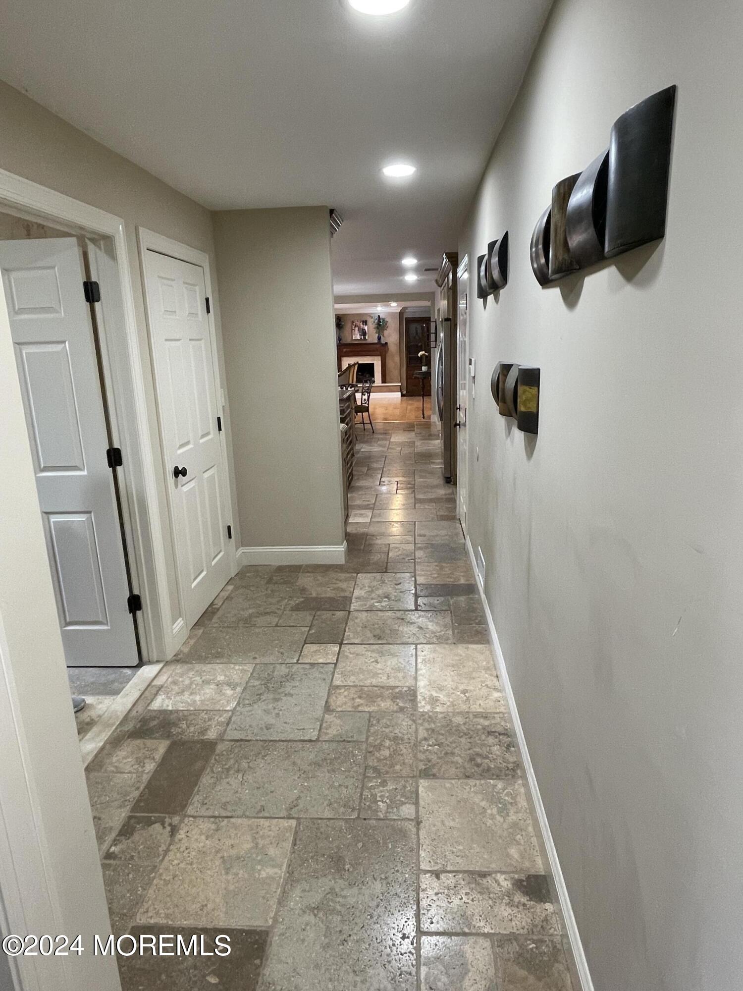 1 Longstreet Road Manalapan, NJ 07726 - Photo 48 of 76 a view of a hallway with a living room
