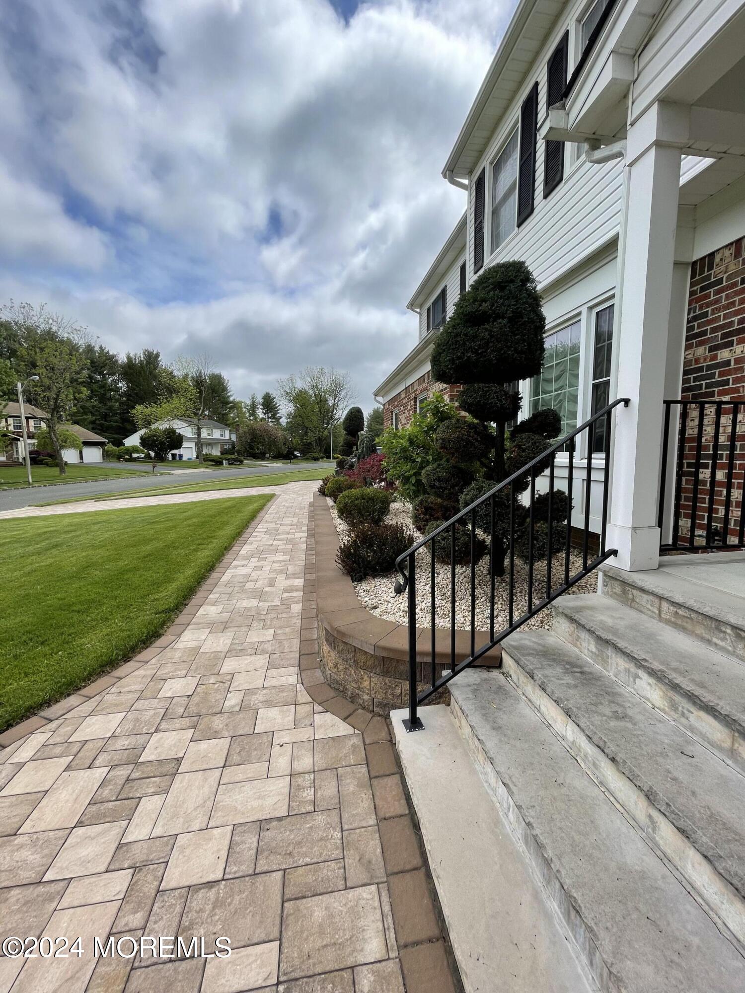 1 Longstreet Road Manalapan, NJ 07726 - Photo 5 of 76 a view of a pathway with a yard