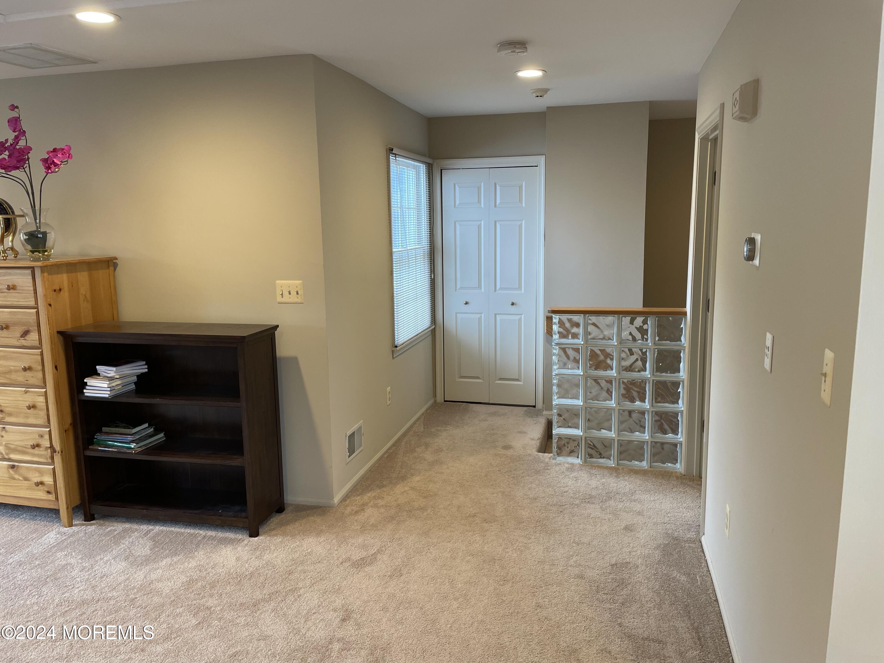 1 Longstreet Road Manalapan, NJ 07726 - Photo 53 of 76 a view of empty room with wooden floor and cabinet