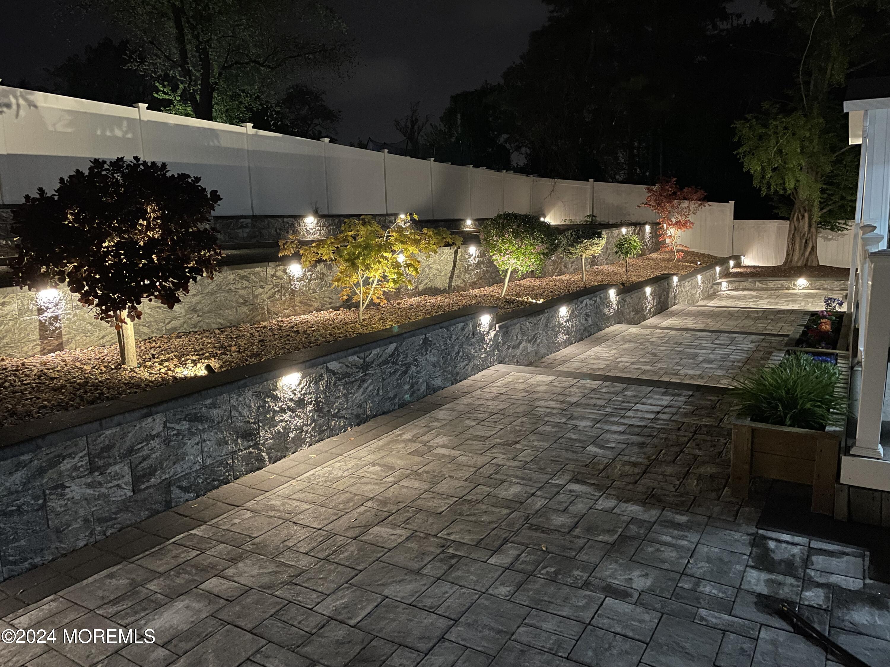 1 Longstreet Road Manalapan, NJ 07726 - Photo 62 of 76 a view of a yard with an outdoor seating