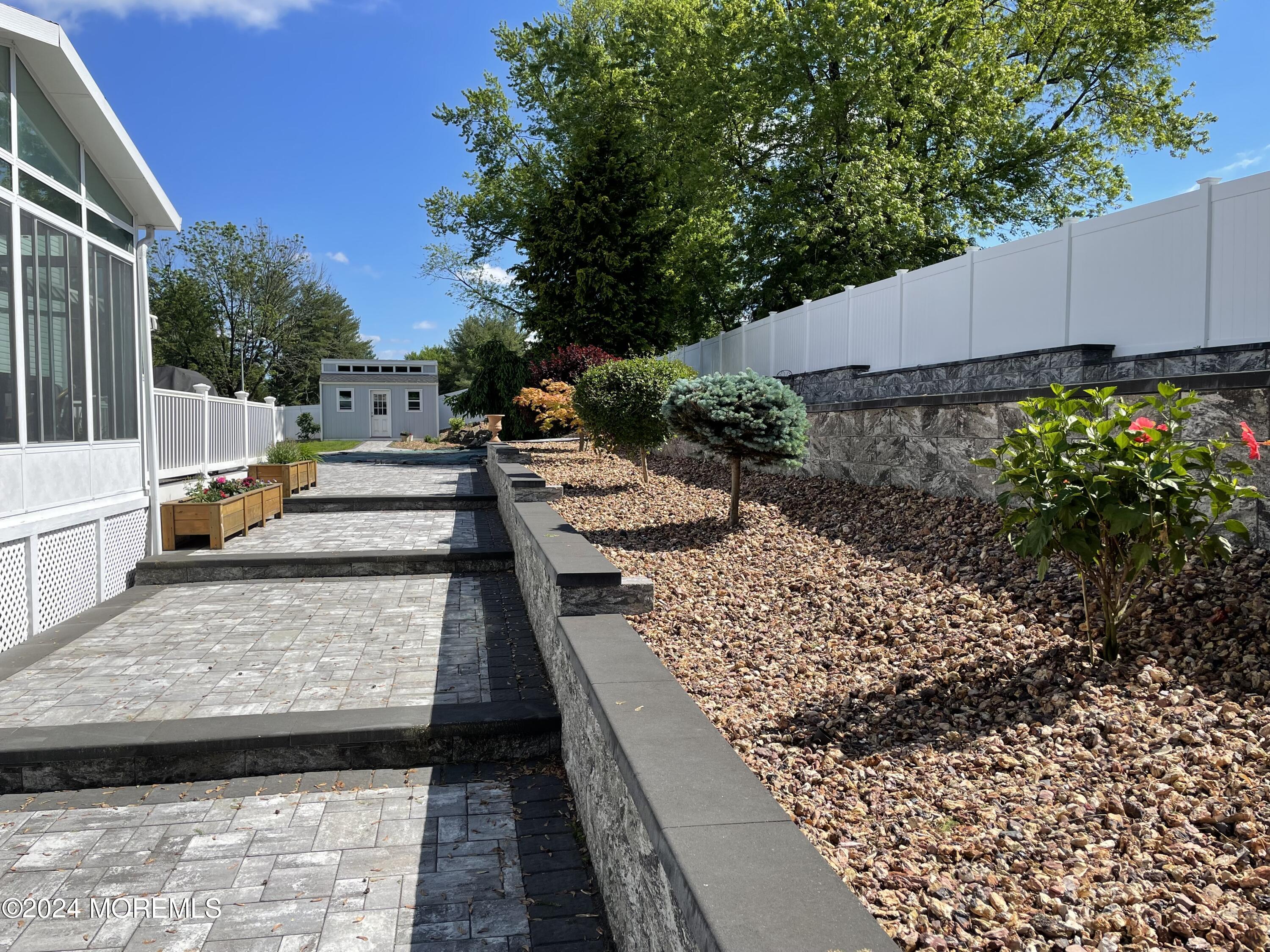 1 Longstreet Road Manalapan, NJ 07726 - Photo 68 of 76 a view of a backyard with sitting area