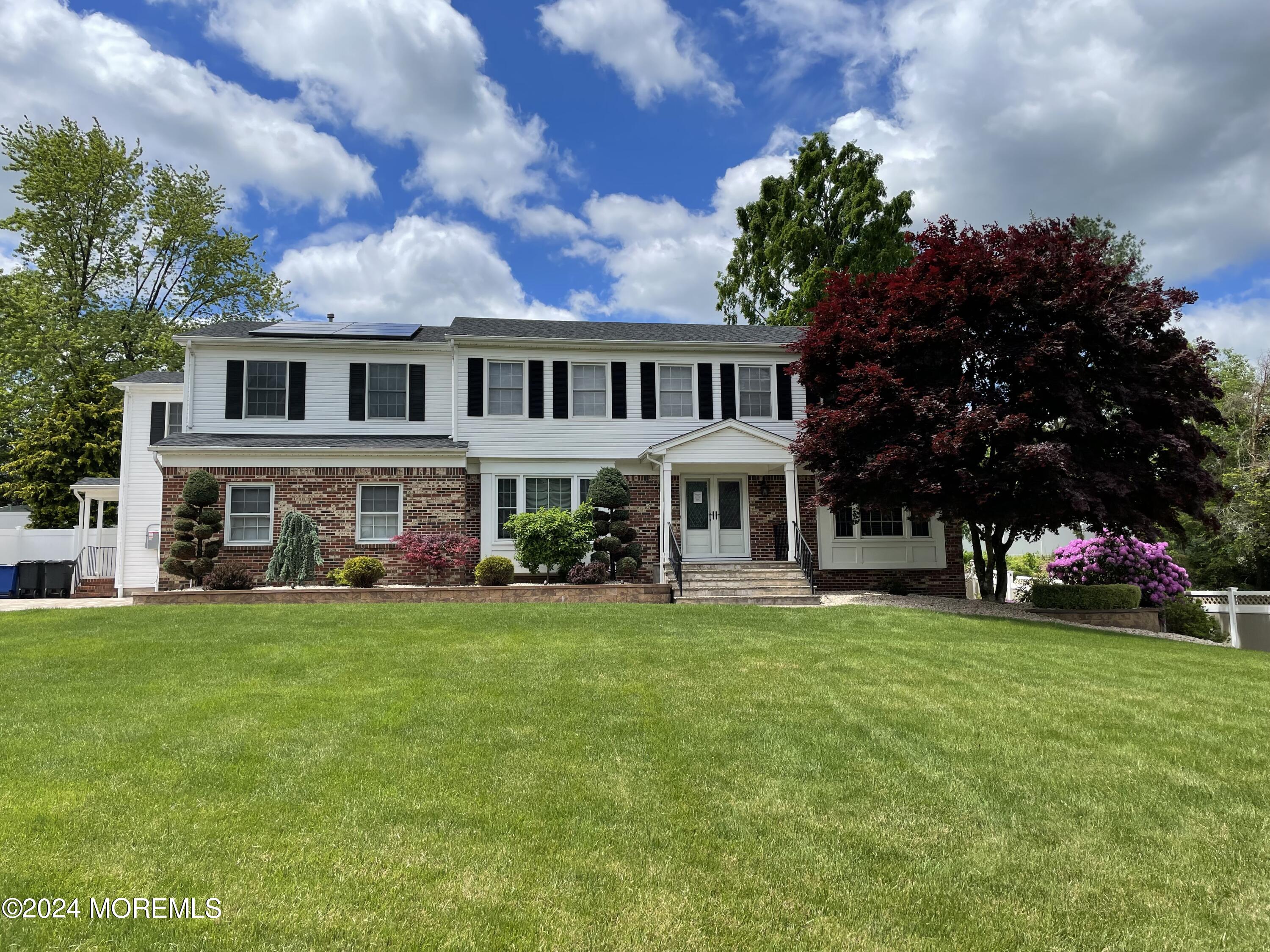 1 Longstreet Road Manalapan, NJ 07726 - Photo 76 of 76 a view of a house with a big yard and a large tree