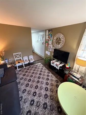 a room with furniture and a wooden floor