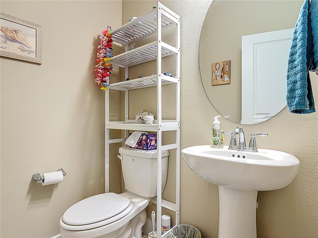 2248 Canopy Terrace Boulevard DeLand, FL 32724 - Photo 16 of 49 a bathroom with a sink mirror and toilet