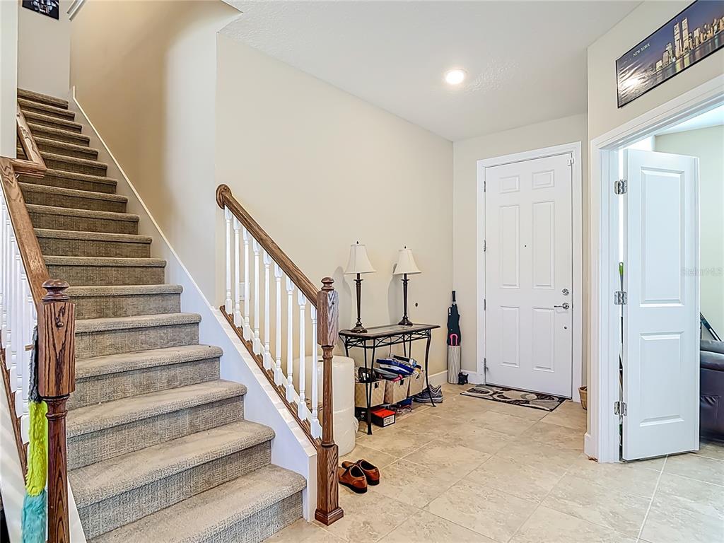 2248 Canopy Terrace Boulevard DeLand, FL 32724 - Photo 18 of 49 a view of a hallway with staircase